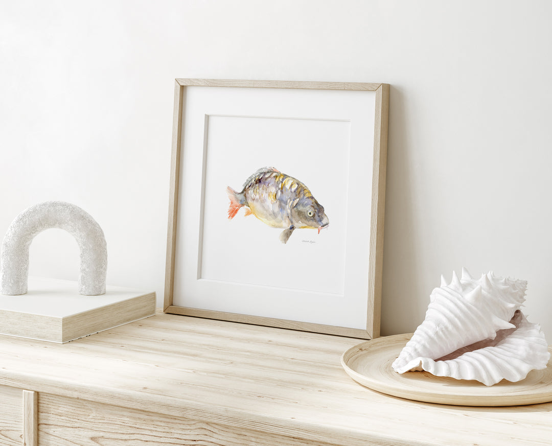 Carp atercolor painting in square frameon table