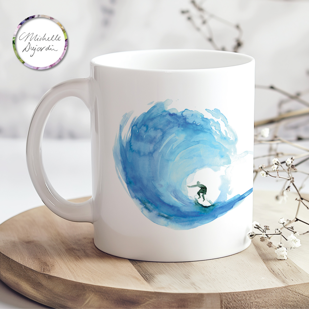 Blue wave and surfer watercolor on a ceramic mug by Michelle Dujardin