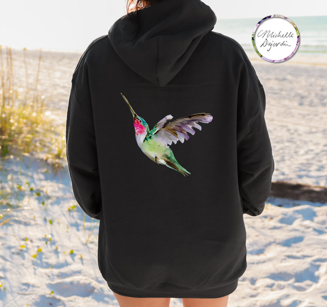 Colorful tropical hummingbird art on black hoodie by Michelle Dujardin