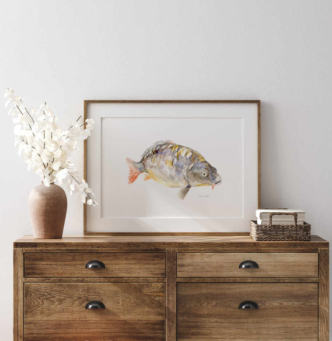carp watercolor painting by Michelle Dujardin in wouden frame on wooden table