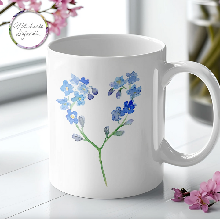 Mug with blue forget-me-nots-flowers in heart shape by Michelle Dujardin