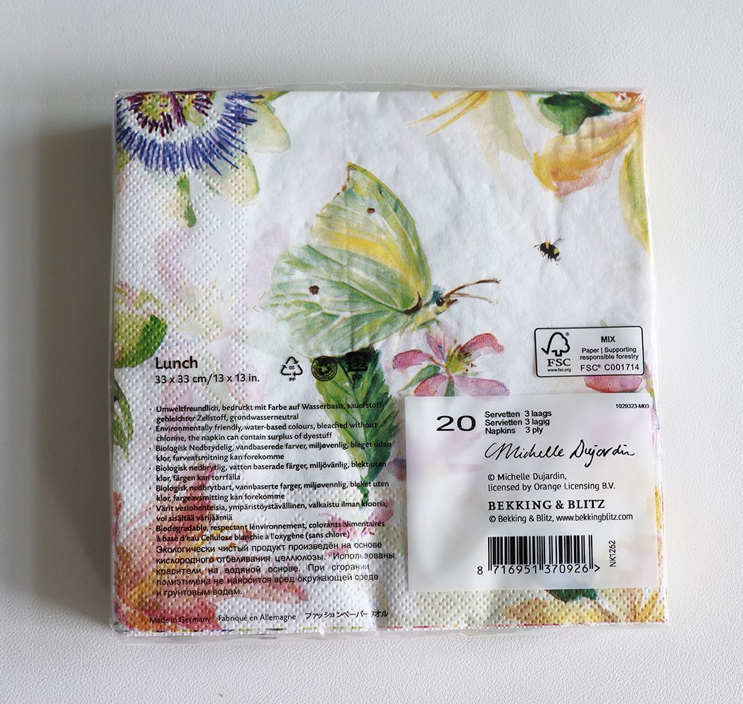 Colorful paper napkins with butterflies and flowers