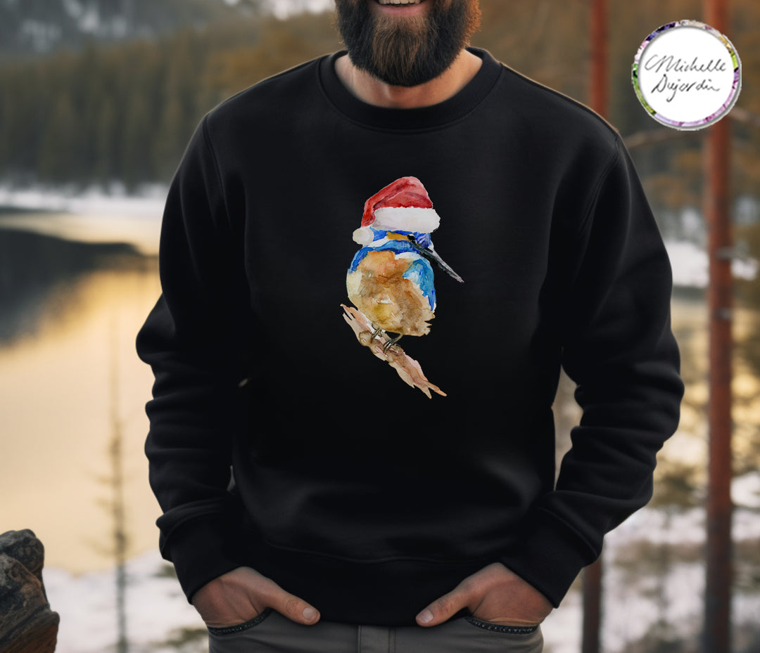 Person wearing a black sweatshirt with a Christmas-themed design of a bird in a Santa hat, standing outdoors.