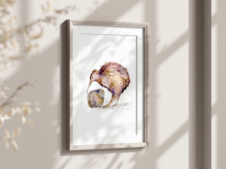 Framed artwork of a mother kiwi bird and her baby on a light background