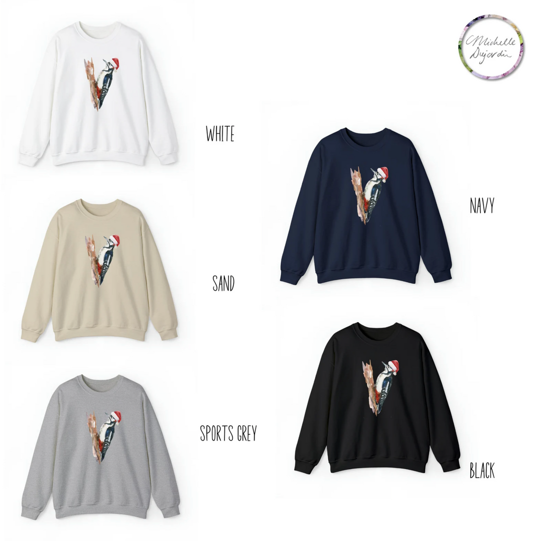 Four sweatshirts in white, navy, sand, and black with a woodpecker design on a white background.