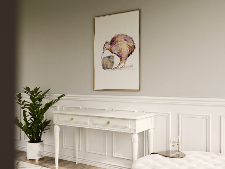 Room interior with a white dresser, plant, and framed artwork of a kiwi bird on a wall.
