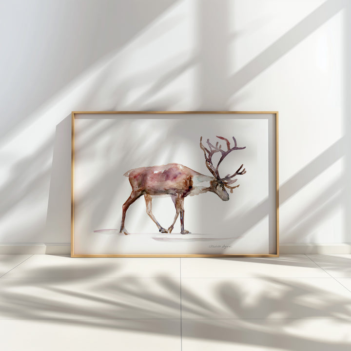 Framed artwork of a reindeer on a white wall with soft shadows