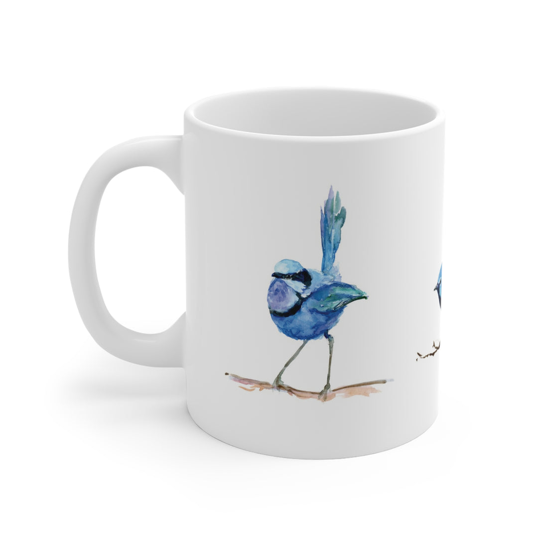 White mug with a blue bird illustration on a white background