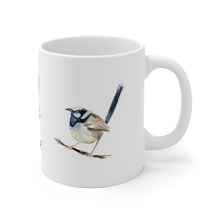 White mug with a bird design on a white background
