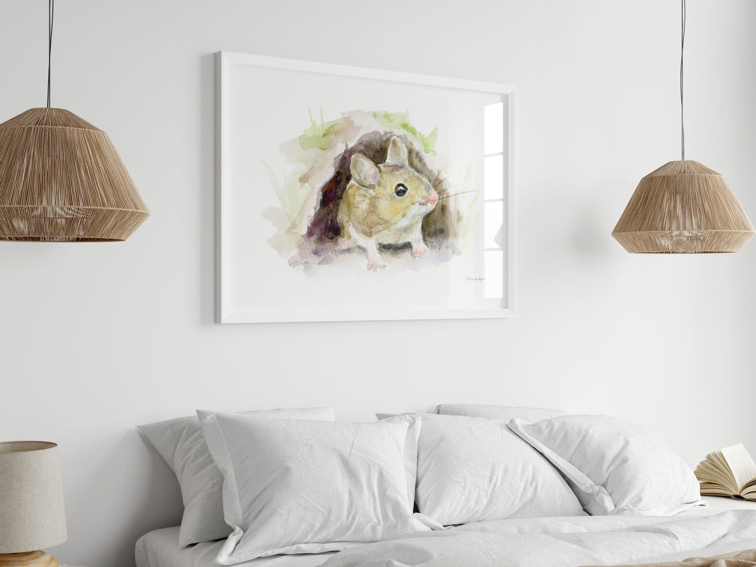 Framed artwork of a wood mouse on a wall above a bed with two pendant lights.